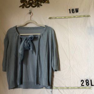 A very pretty light Blue sweater with a Satin bow